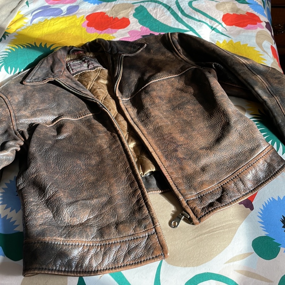 Classic distressed, brown, leather bomber jacket.